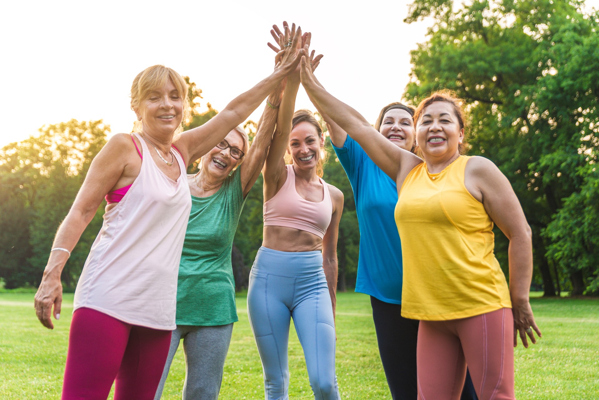 Senior women training with fitness coach at park